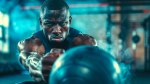 A Fit and focused muscular man performing medicine ball workouts