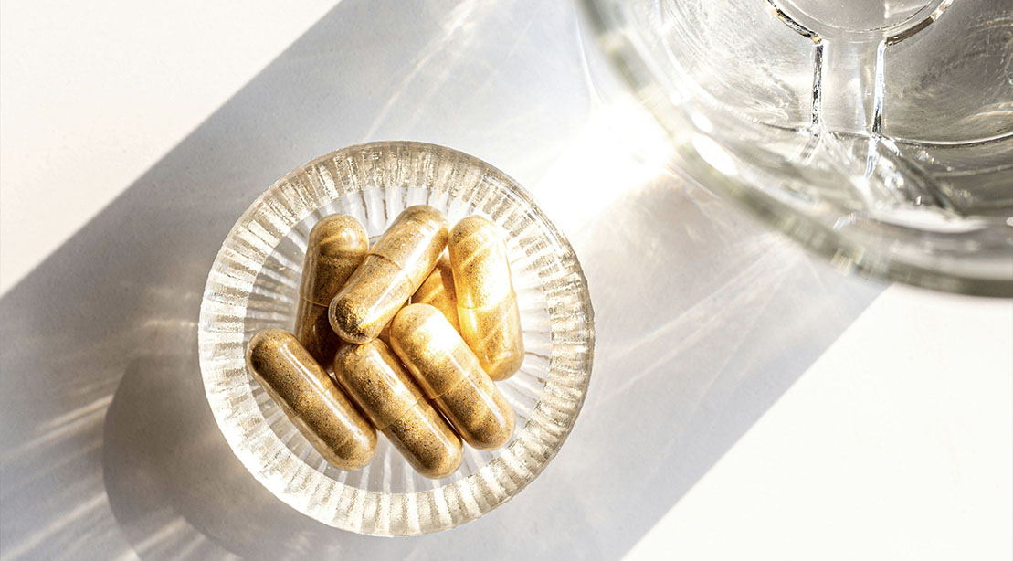 Ashwagandha supplement pills in a ray of sunlight