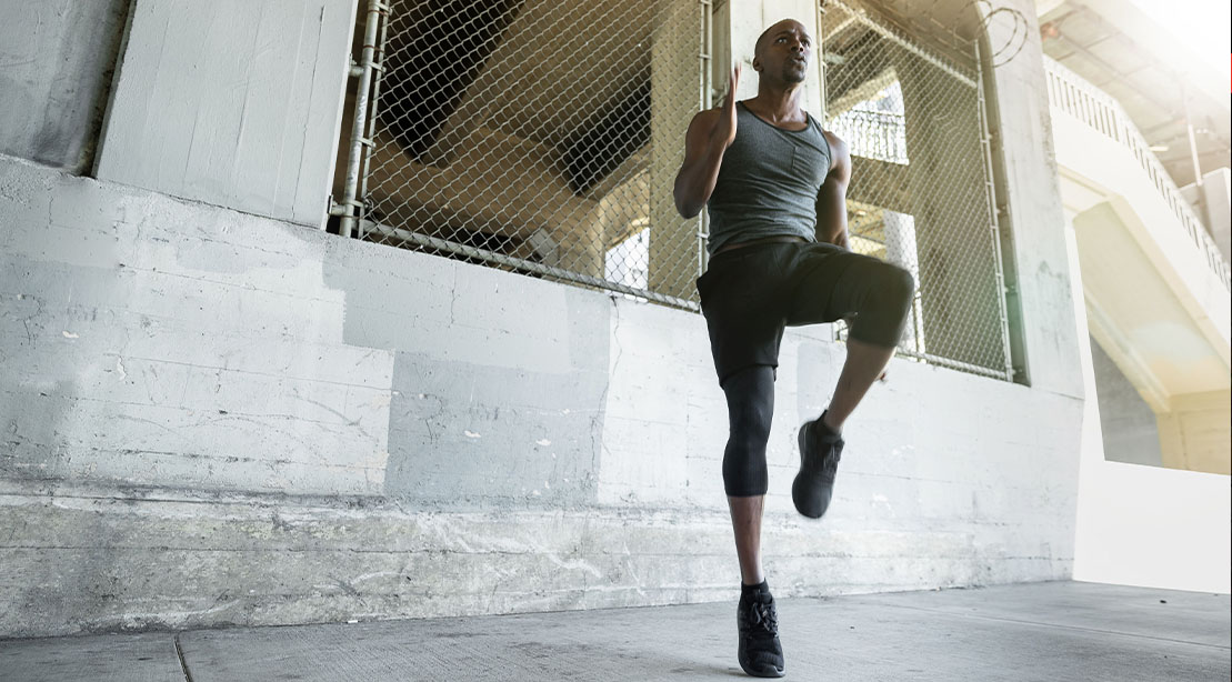 Black man working outdoors with a 15 minute bodyweight cardio workout