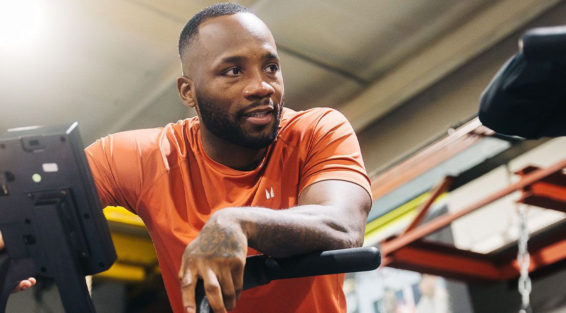 Leon Edwards taking a break from training and leaning against the ropes