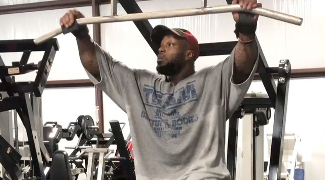 Shaun Clarida using the pulldown machine for his 5 back exercises for olympia training