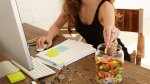 Stressed out young lady working from home snacking on gummy worms and candy to combat the nueropeptide Orexin